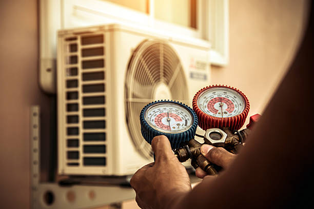 Professional Air Conditioning Service technician working in Oakland, MI